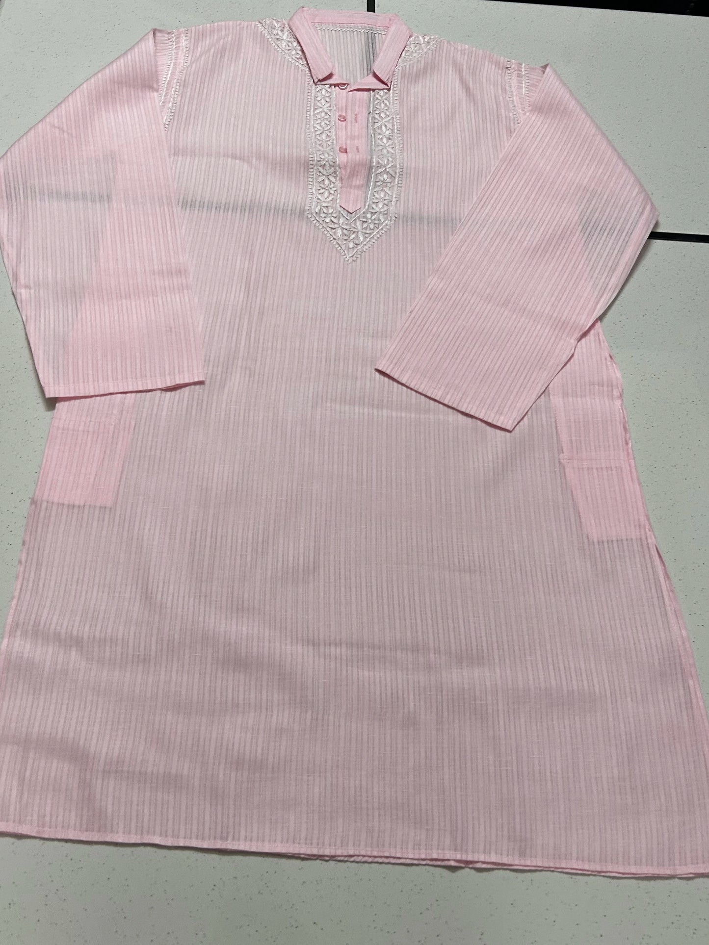 lucknowi chikankari Pink striped shirt with decorative neckline on a light gray background