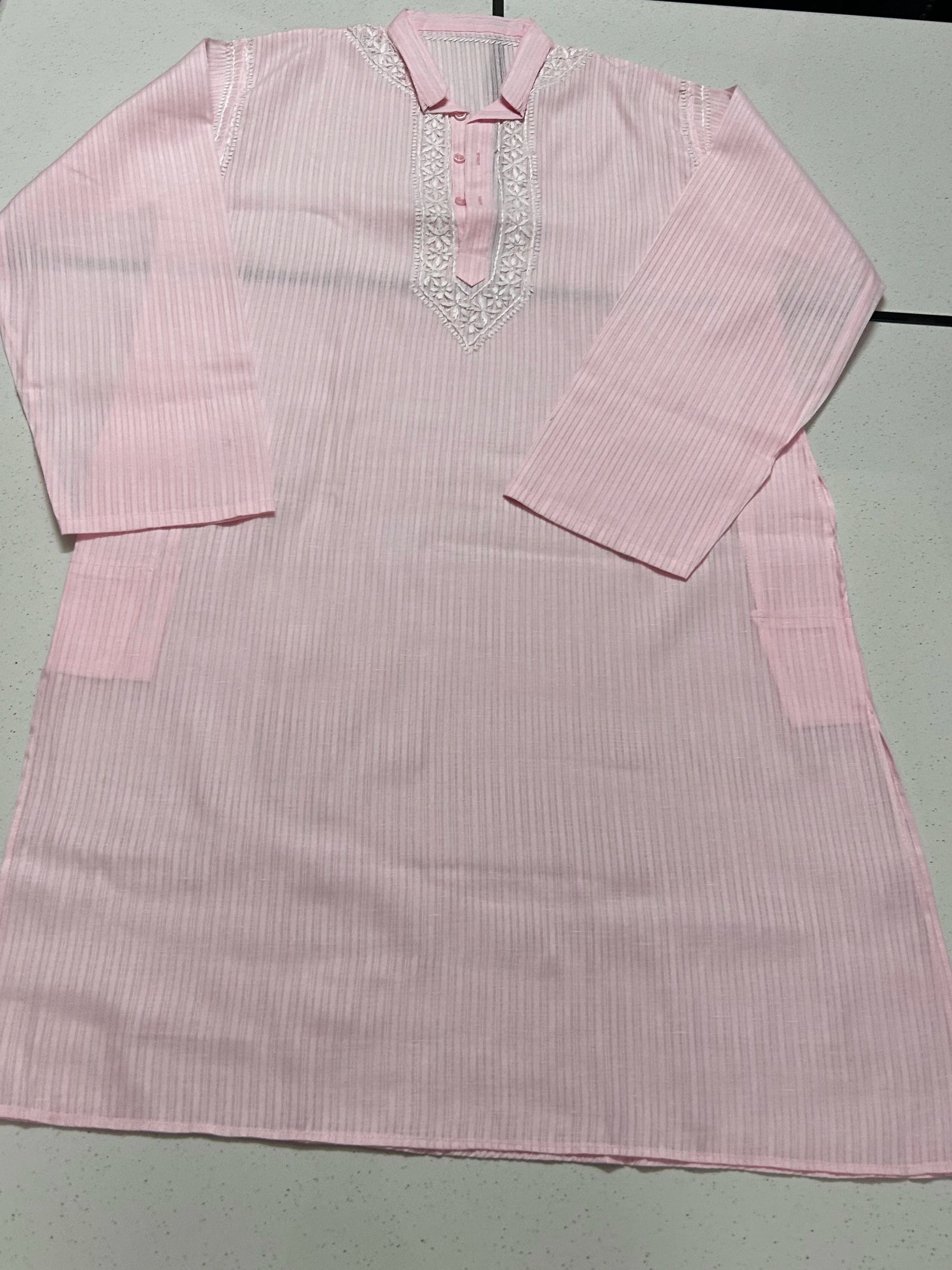 lucknowi chikankari Pink striped shirt with decorative neckline on a light gray background