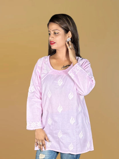 lucknowi chikankari Woman wearing a light purple top with white patterns on a beige background