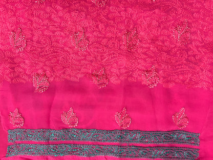 Close-up of a red floral embroidery pattern on fabric