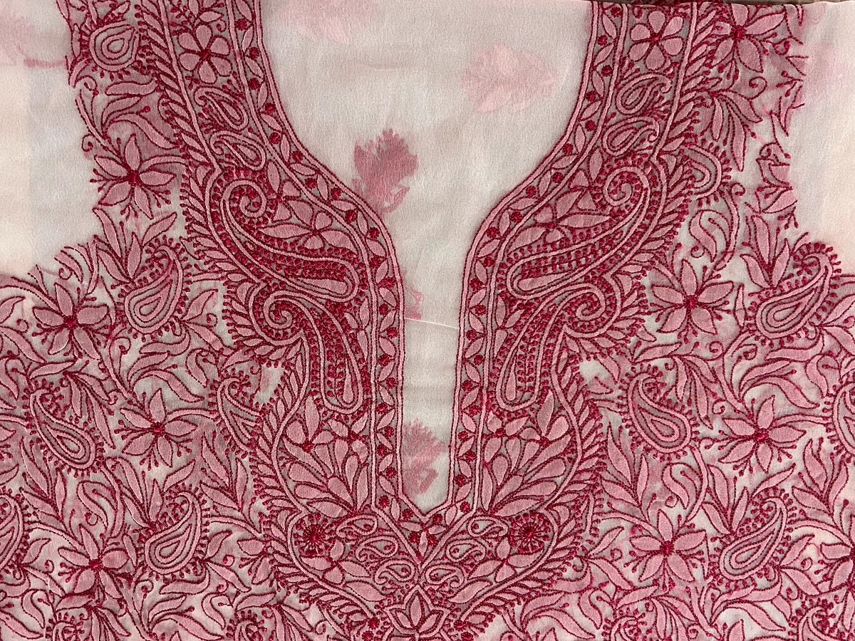 Close-up of a red floral embroidery pattern on fabric