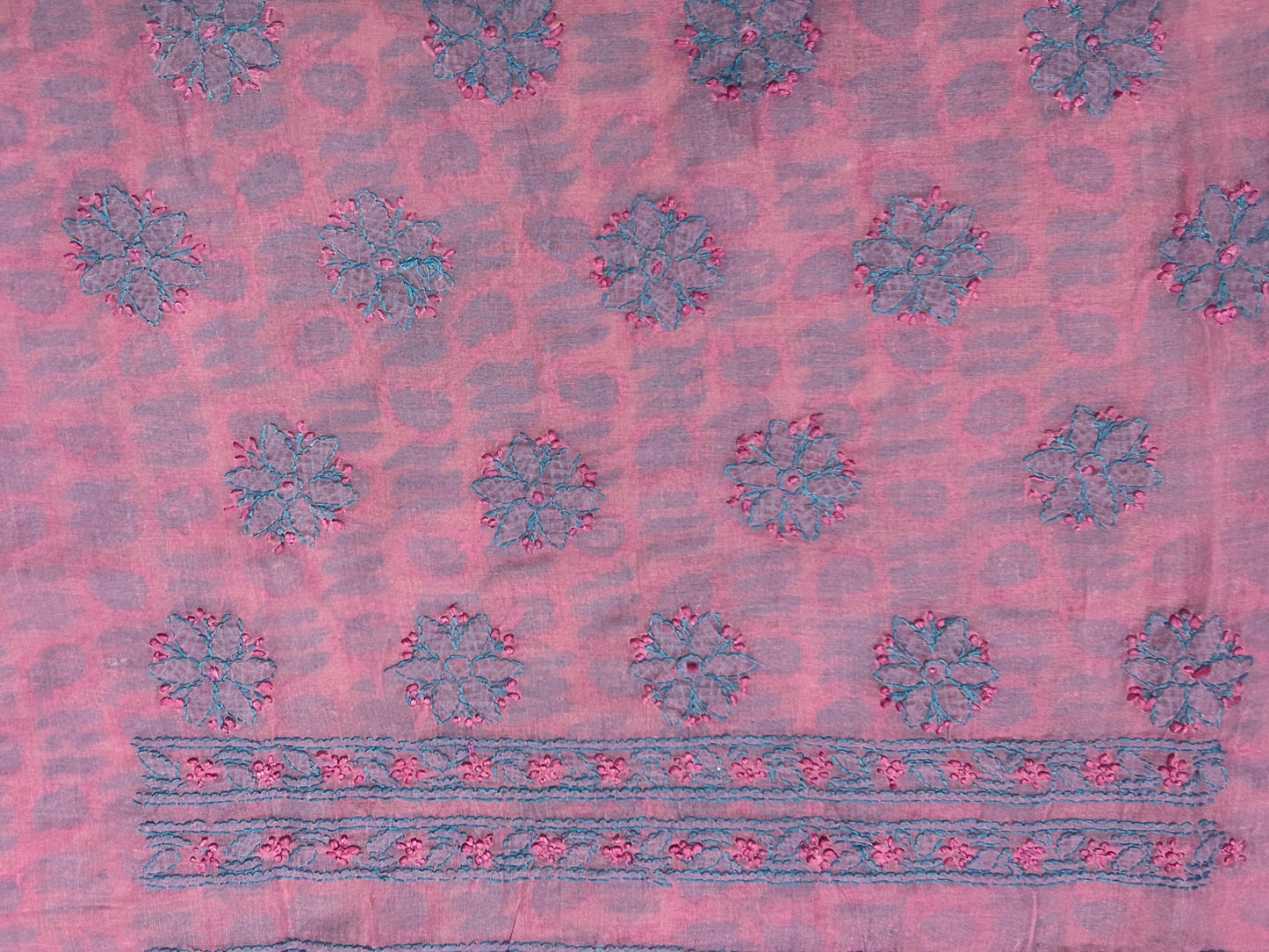 Pink fabric with blue floral patterns and border