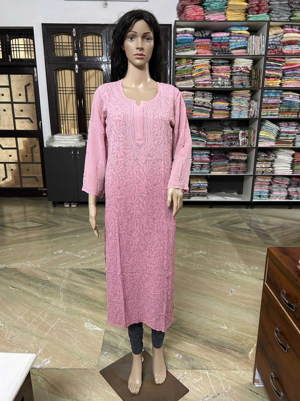 Mannequin wearing a lucknowi chikankari pink-colored kurta