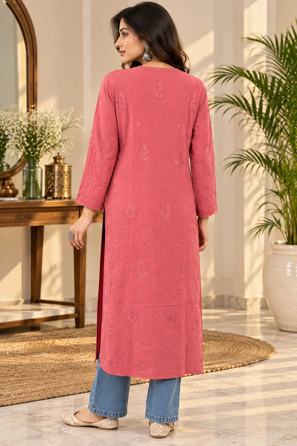 Woman wearing a lucknowi chikankari red-colored kurta