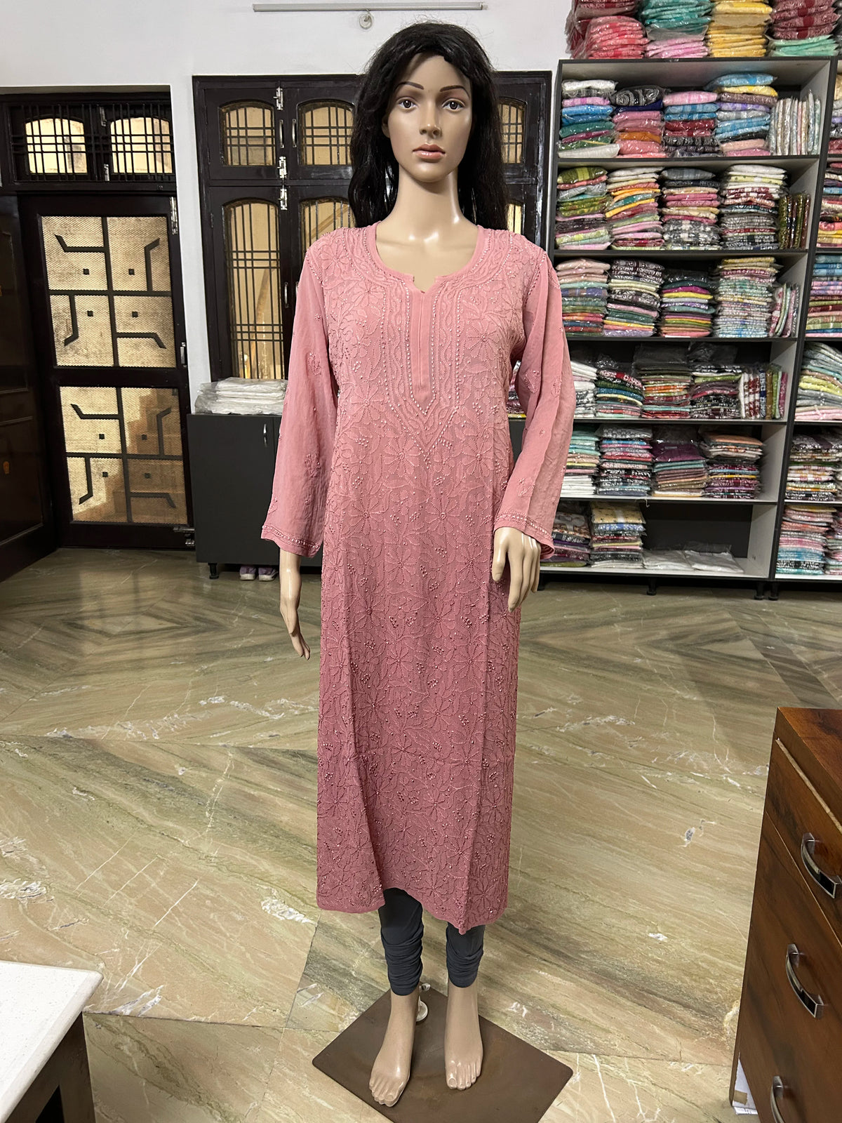 Mannequin wearing a lucknowi chikankari pink-colored kurta