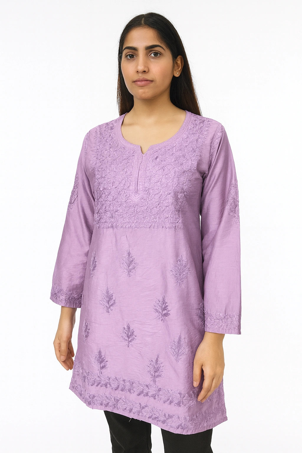Woman wearing a purple embroidered kurta against a white background