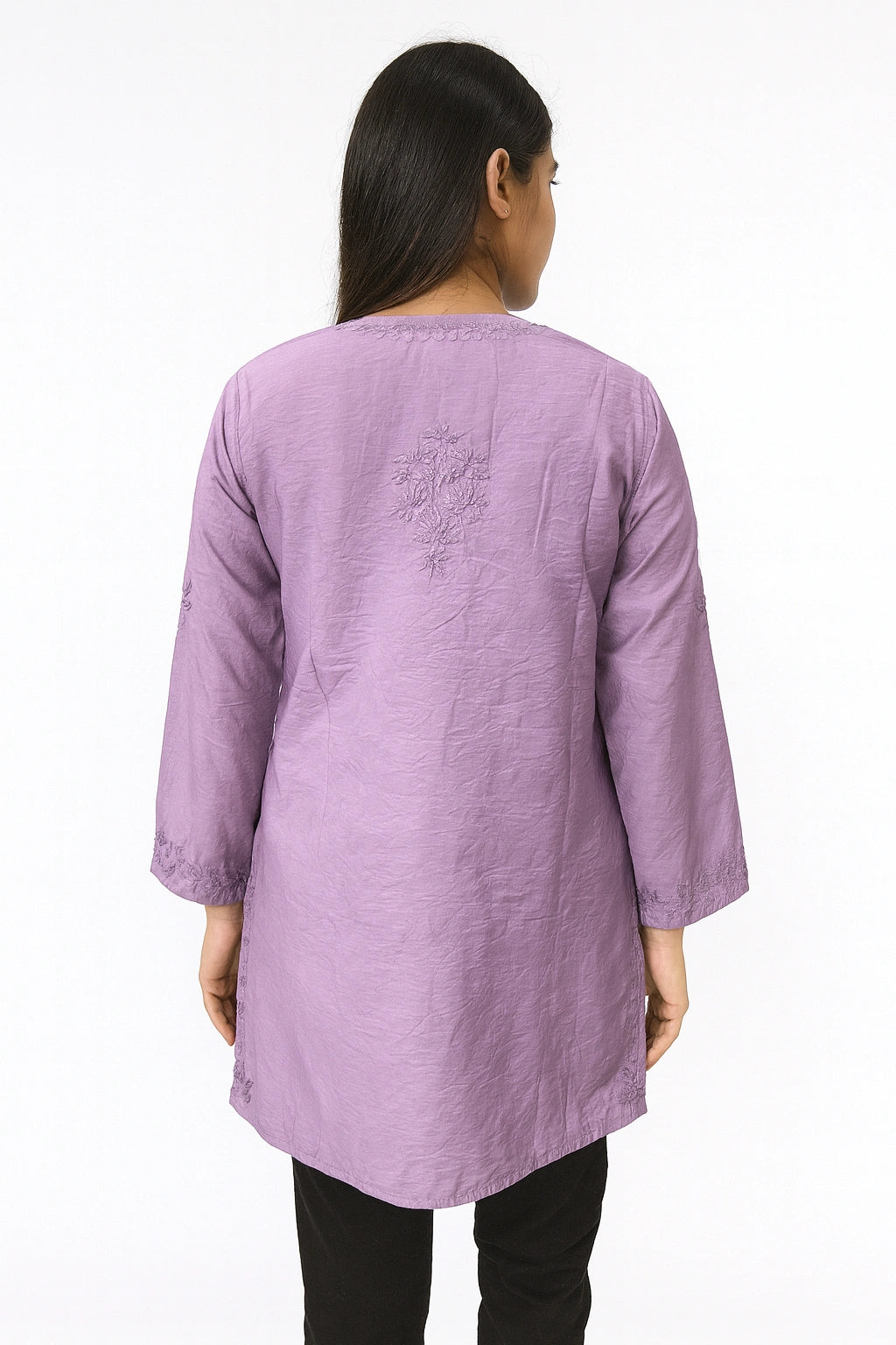 Person wearing a lucknowi chikankari purple long-sleeve top on a white background