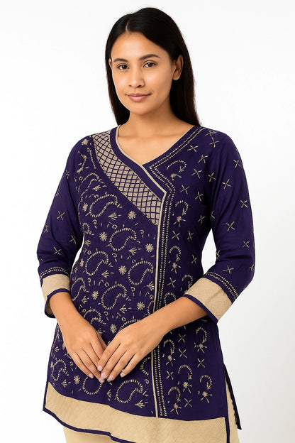 Woman wearing a lucknowi chikankari purple and beige traditional outfit with intricate patterns on a white background