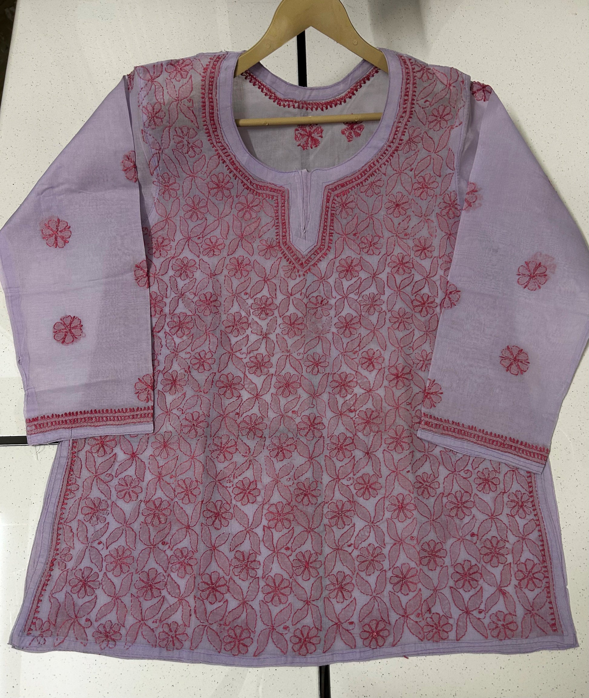 lucknowi chikankari Light purple traditional outfit with red floral patterns on a white background