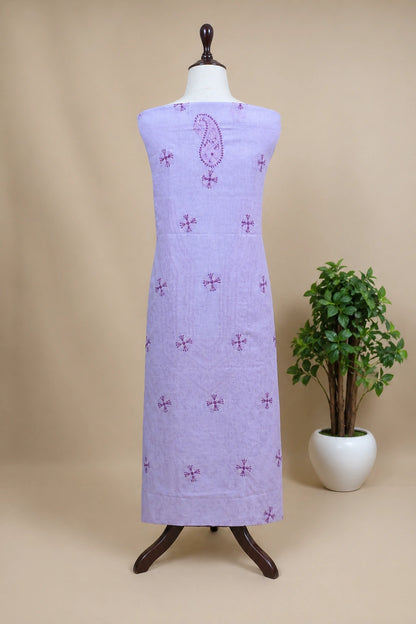 lucknowi chikankari Purple dress with pattern on a mannequin against a beige background