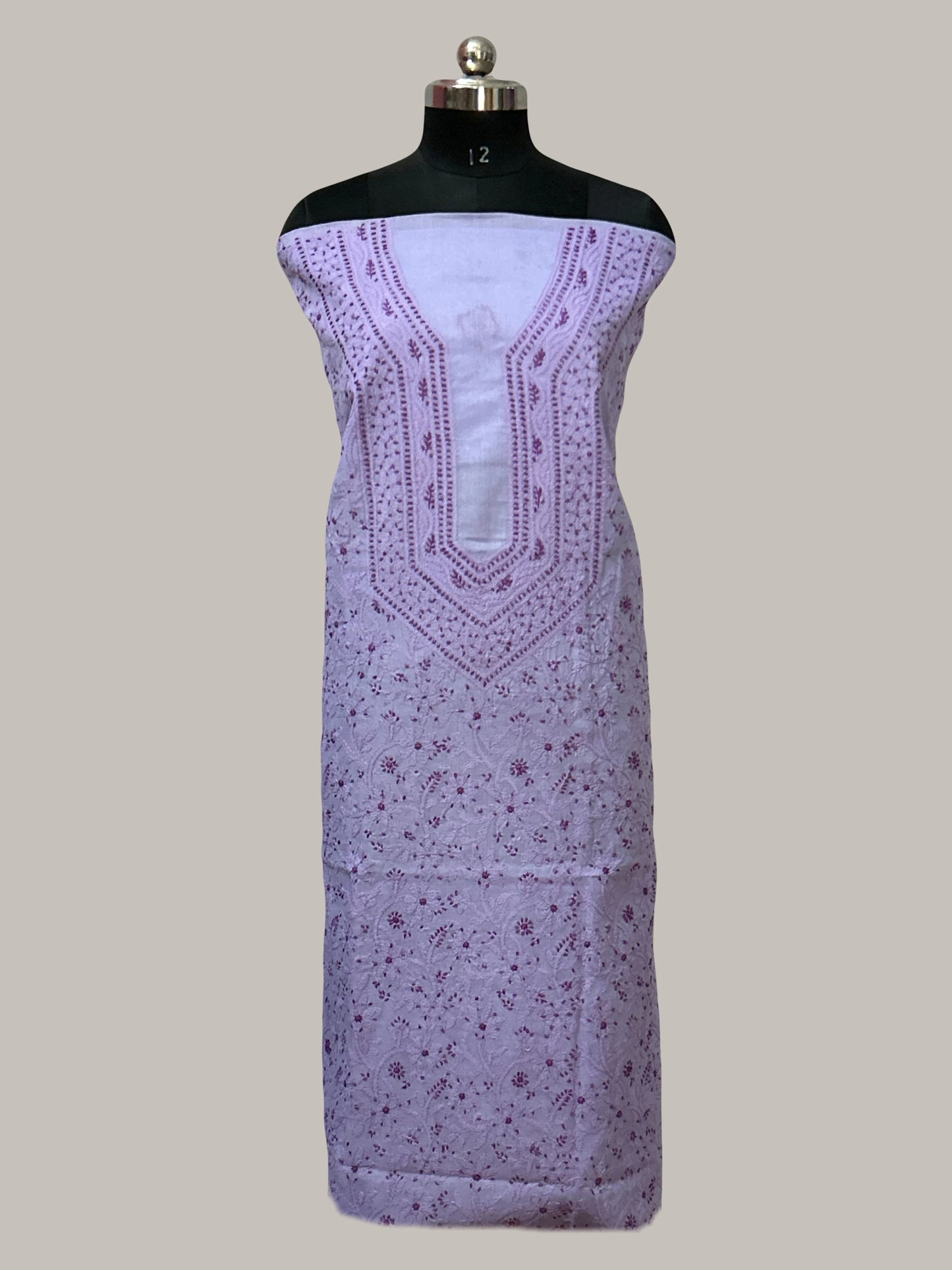 lucknowi chikankari Purple embroidered dress on a mannequin against a plain background