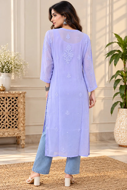 Woman wearing a lucknowi chikankari purple-colored kurta