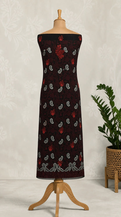 lucknowi chikankari Black strapless dress with red and white floral pattern on a mannequin against a light background.