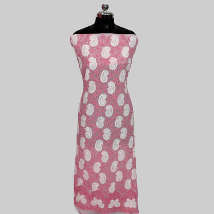 Mannequin wearing a lucknowi chikankari pink dress with white floral patterns on a gray background