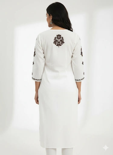 White kurta with black floral embroidery on a white background