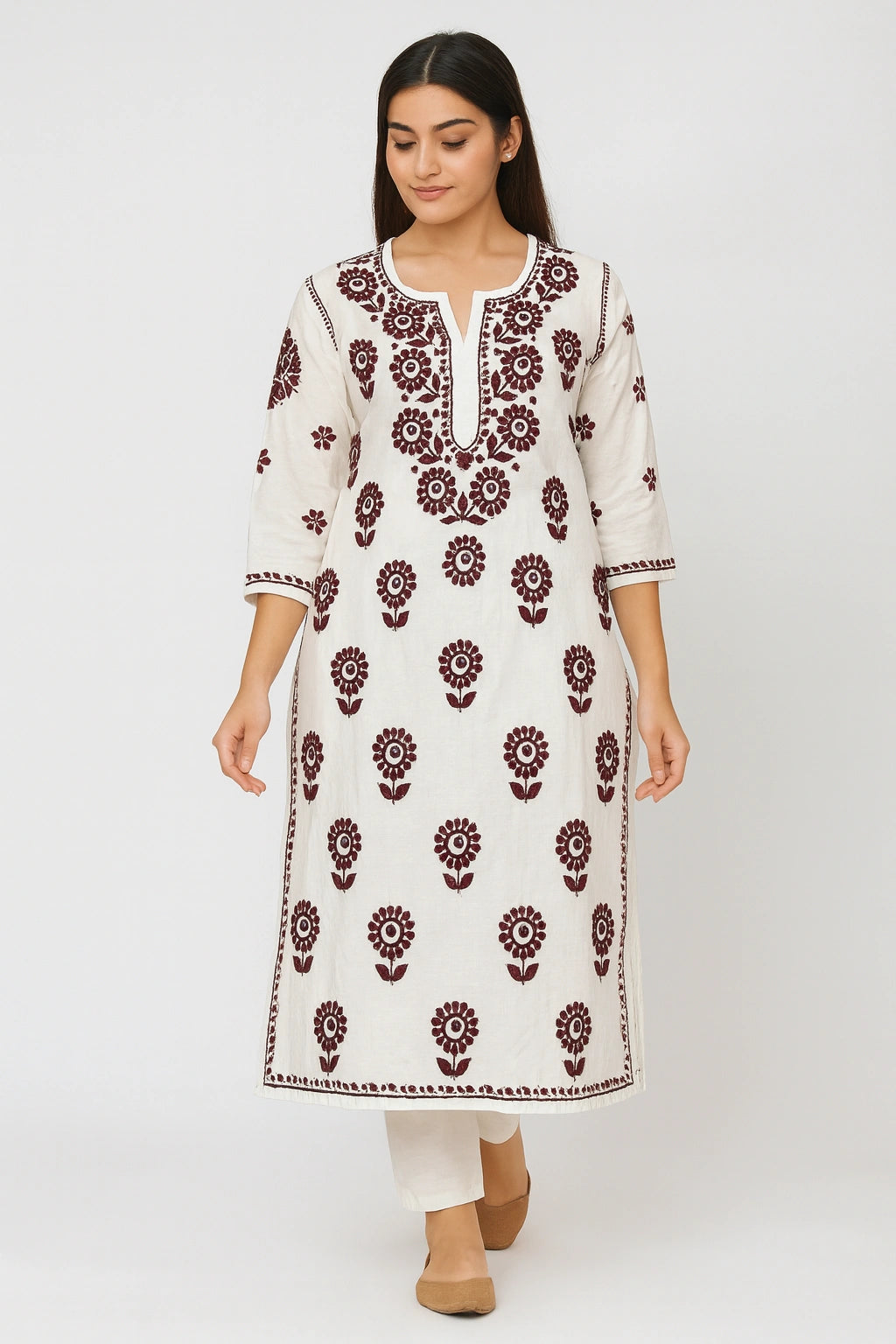 lucknowi chikankari Woman wearing a white kurta with red floral patterns on a white background
