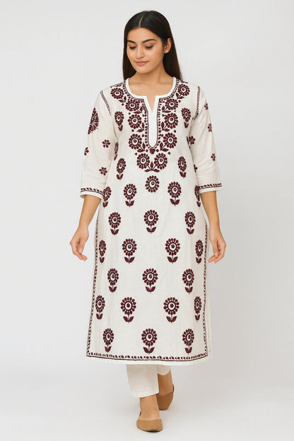 lucknowi chikankari Woman wearing a white kurta with red floral patterns on a white background