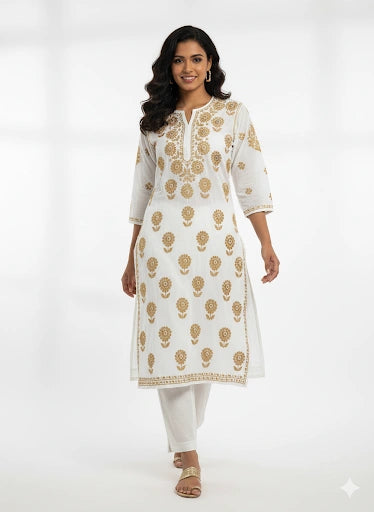 Woman wearing a lucknowi chikankari white kurta with gold patterns on a white background