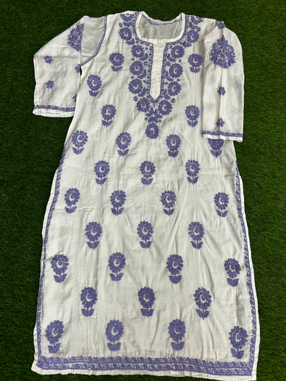 lucknowi chikankari White dress with purple floral patterns on a green background