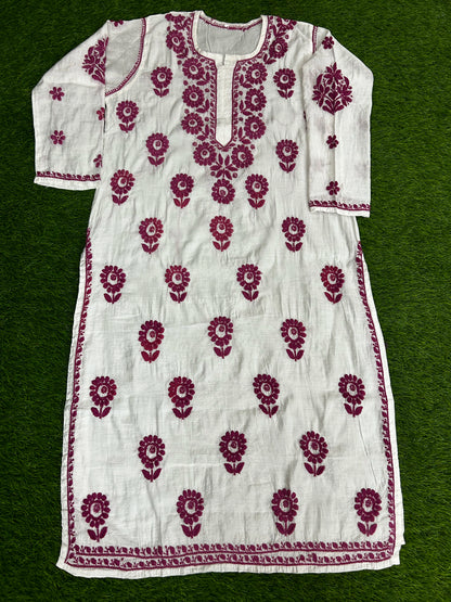 lucknowi chikankari White dress with red floral patterns on a green background