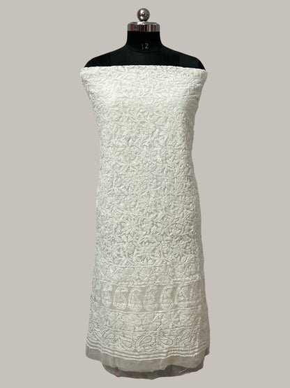 Lucknowi chikankari White textured dress on a mannequin against a plain background