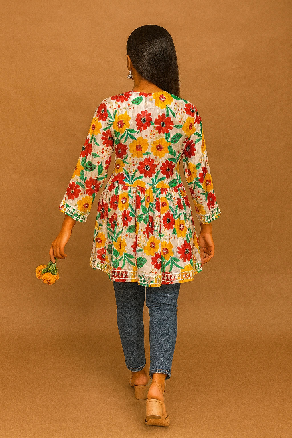 lucknowi chikankari Woman wearing a floral kimono-style jacket against a brown background