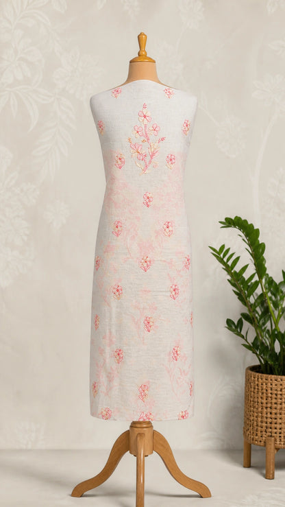 Lucknowi chikankari Mannequin wearing a white dress with pink floral patterns against a neutral background.