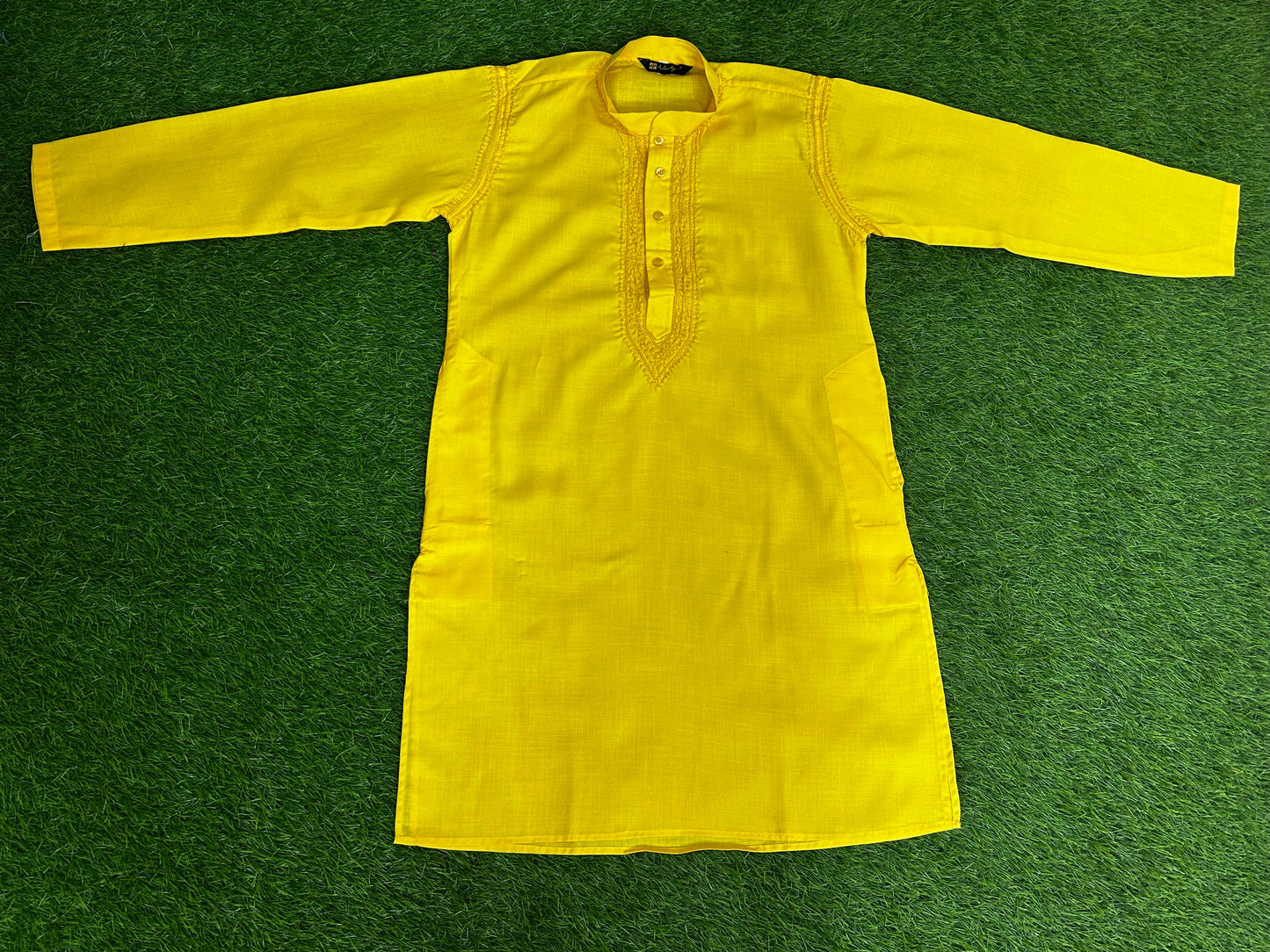 lucknowi chikankari Yellow jacket on a green grass background